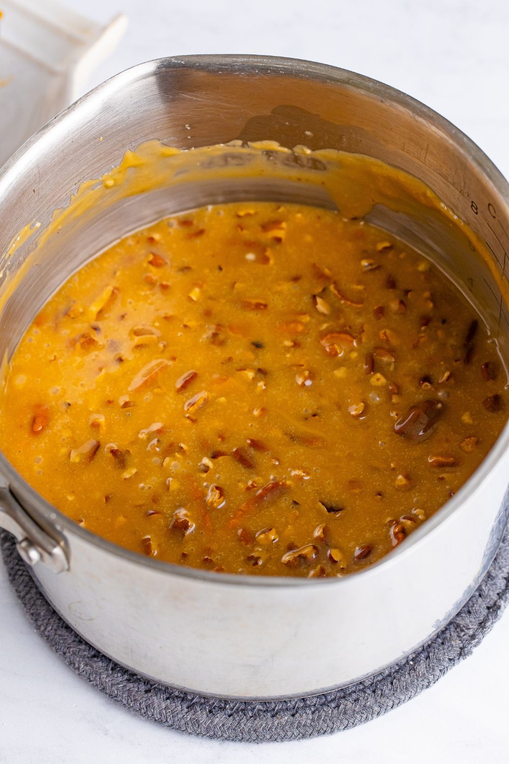 praline pecan icing in a metal pan on table