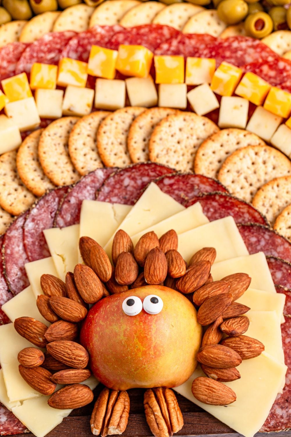 Turkey Snack Board on table with close up of apple with candy eyes on it