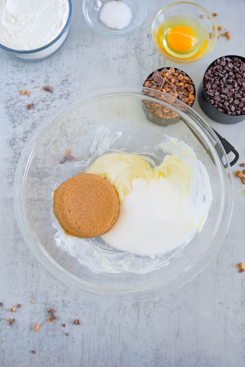 butter and sugar in a glass bowl on table