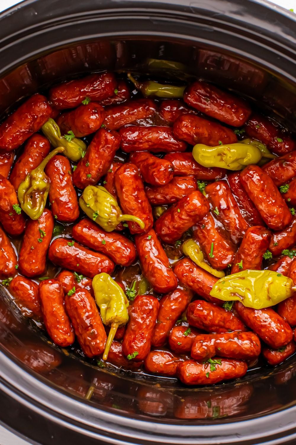 cocktail weenies in slow cooker on table