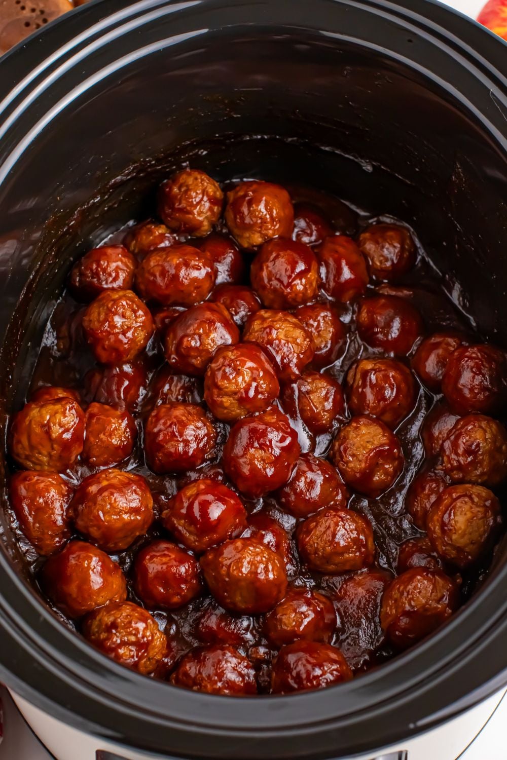 overhead look of Crockpot Apple Butter Meatballs in crockpot