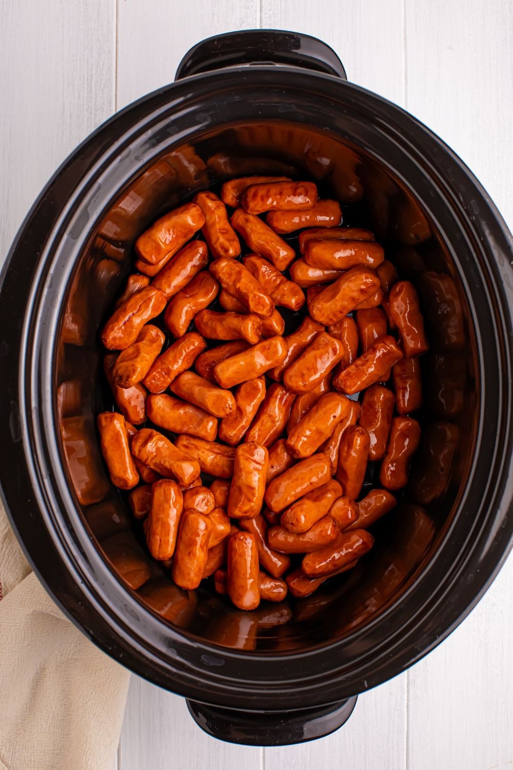 lil smokies in a slow cooker on counter 