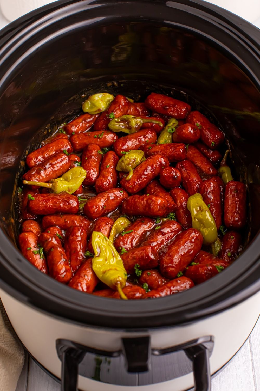 mississippi mini sausages in a slow cooker sitting on table