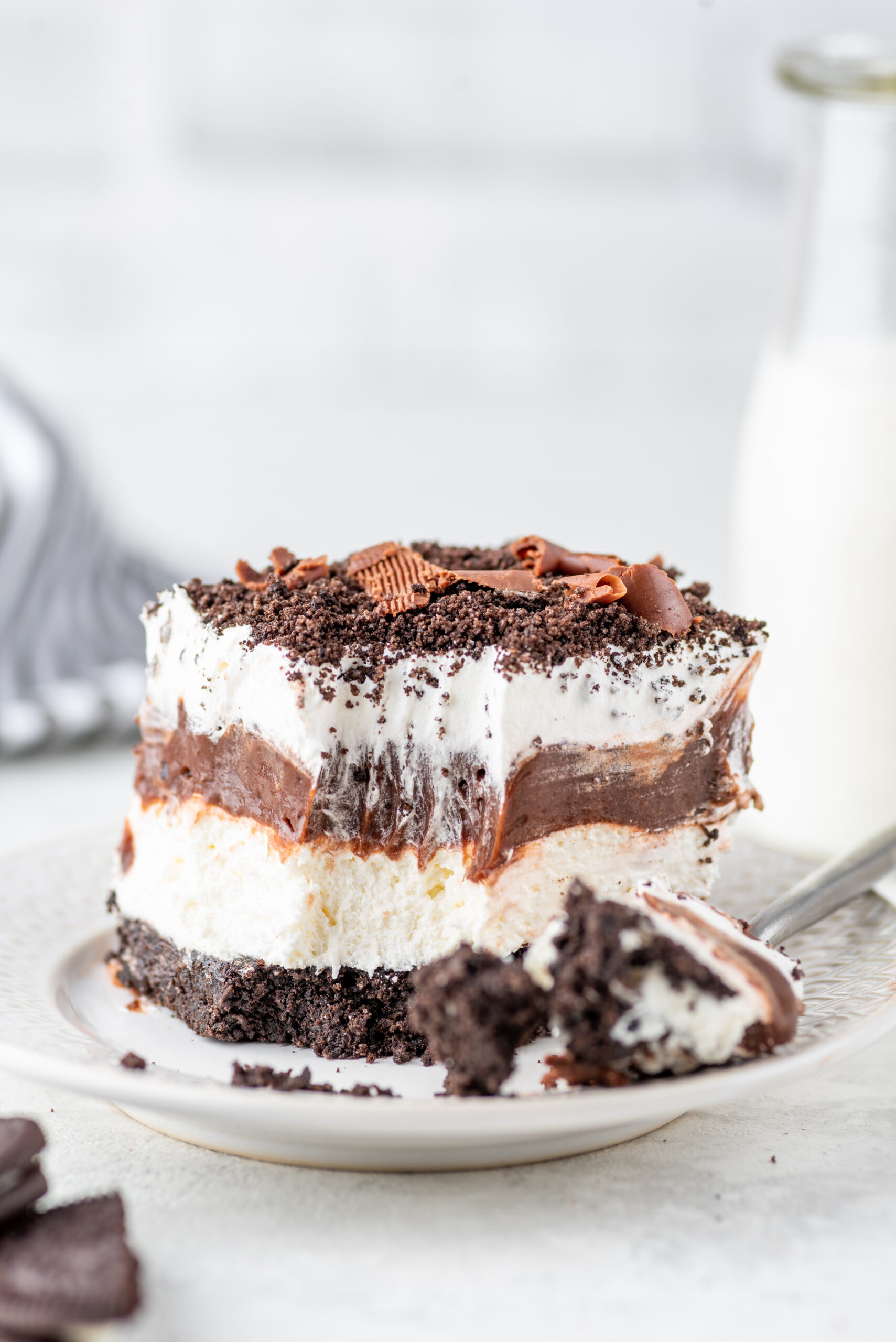 Chocolate Oreo Lush placed on plate with a bite taken out of it 