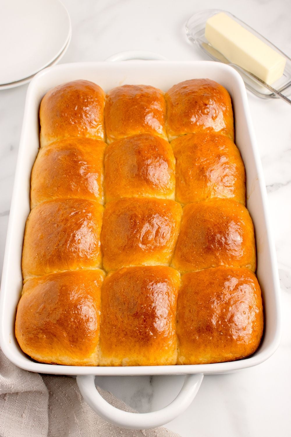 Pull Apart Dinner Rolls in a baking dish on the counter