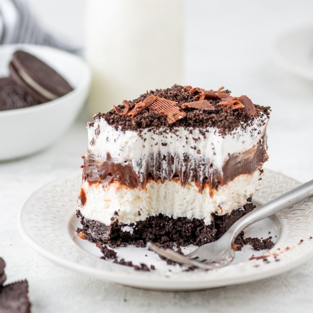Chocolate Oreo Lush placed on plate with a bite taken out of it 