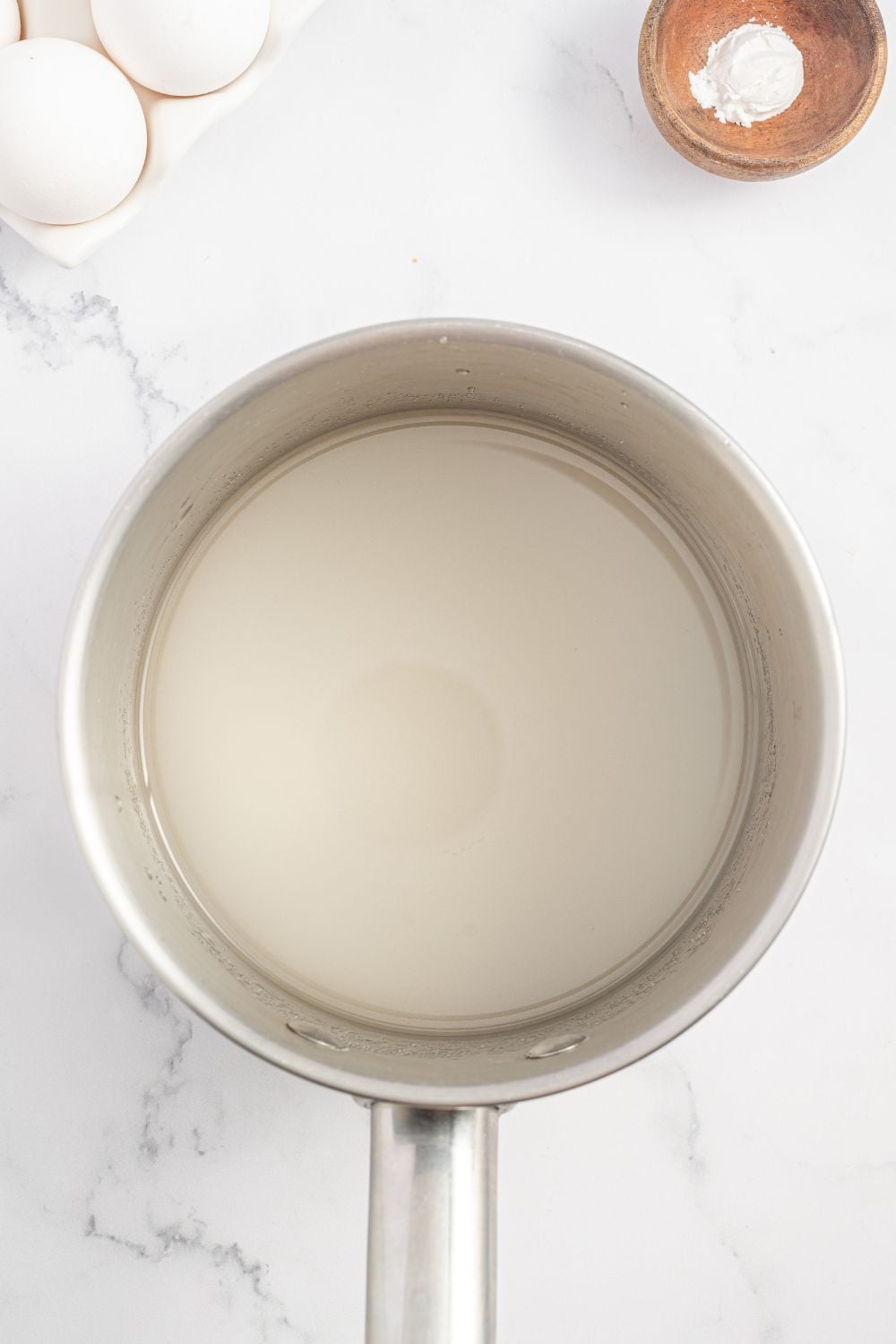 mixture for making a Coconut Meringue Pie in a saucepan 