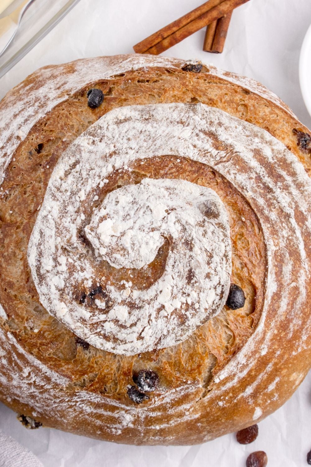 cinnamon raisin bread loaf on table with overhead shot of bread