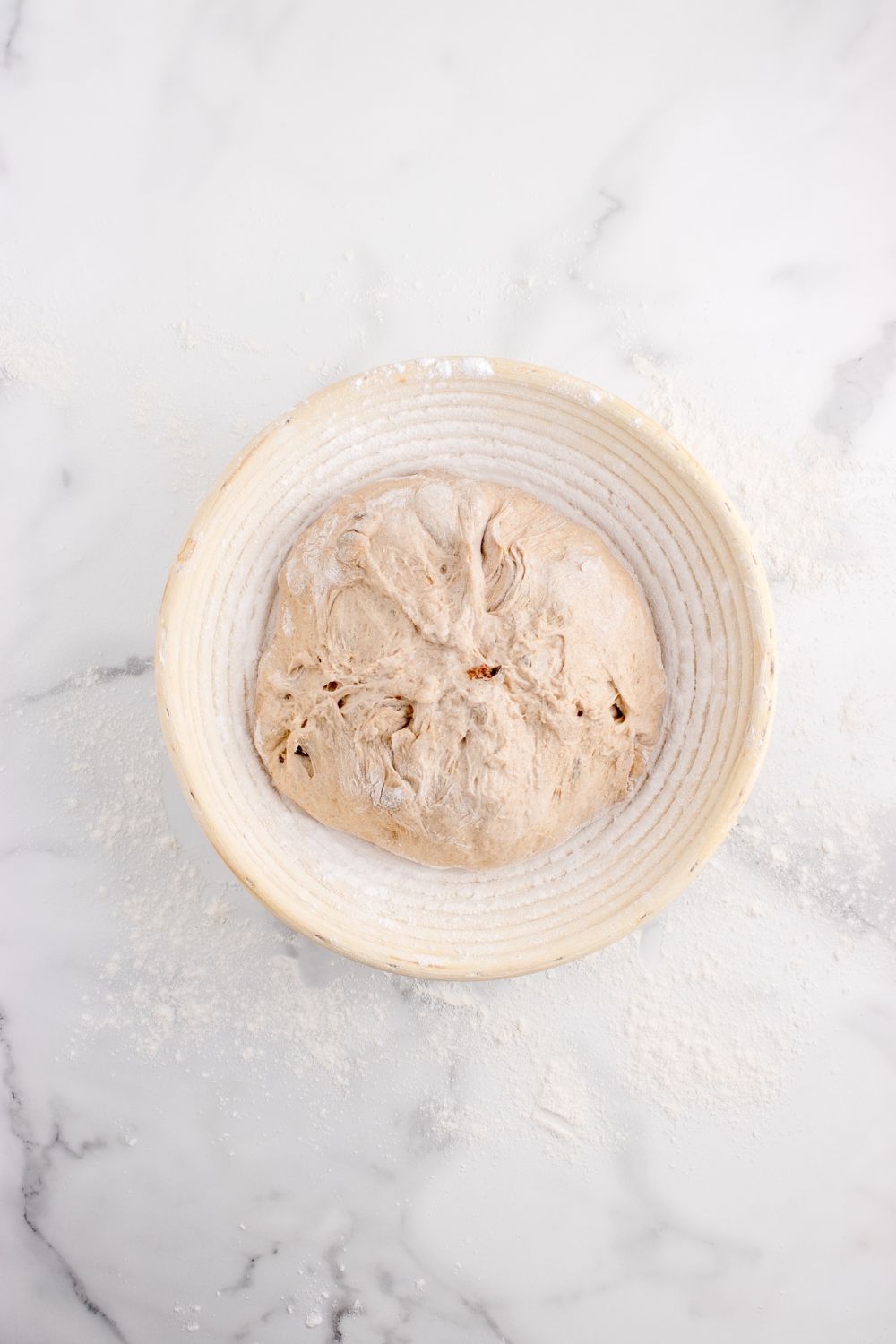 bread dough in a bowl on table for raisin bread