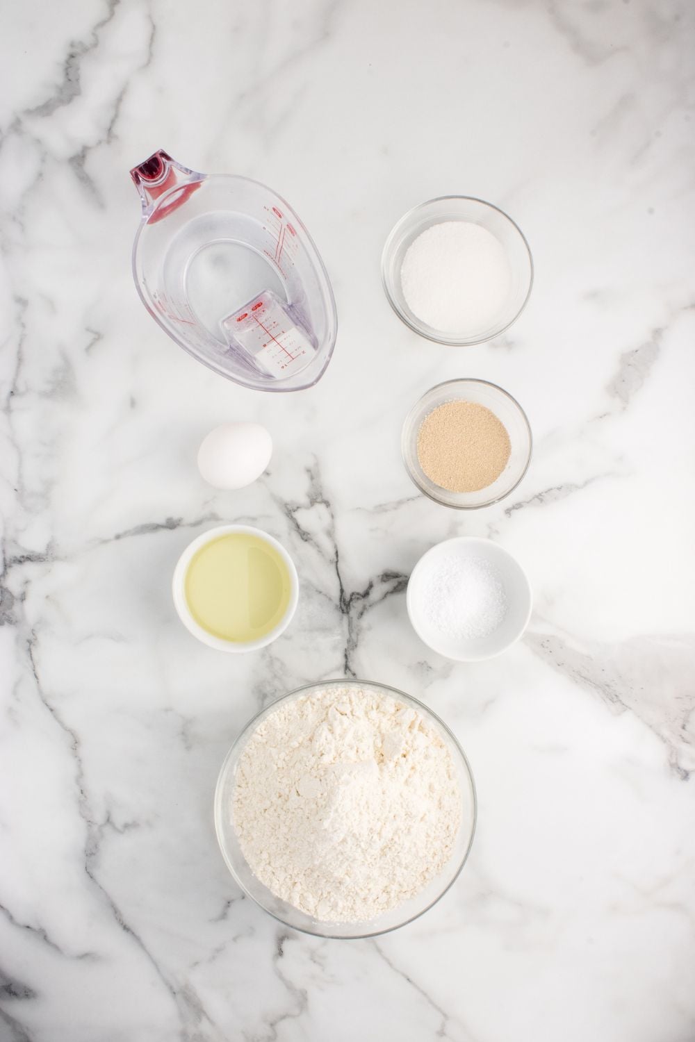 all the ingredients to make Pull Apart Dinner Rolls in single serve containers sitting on counter