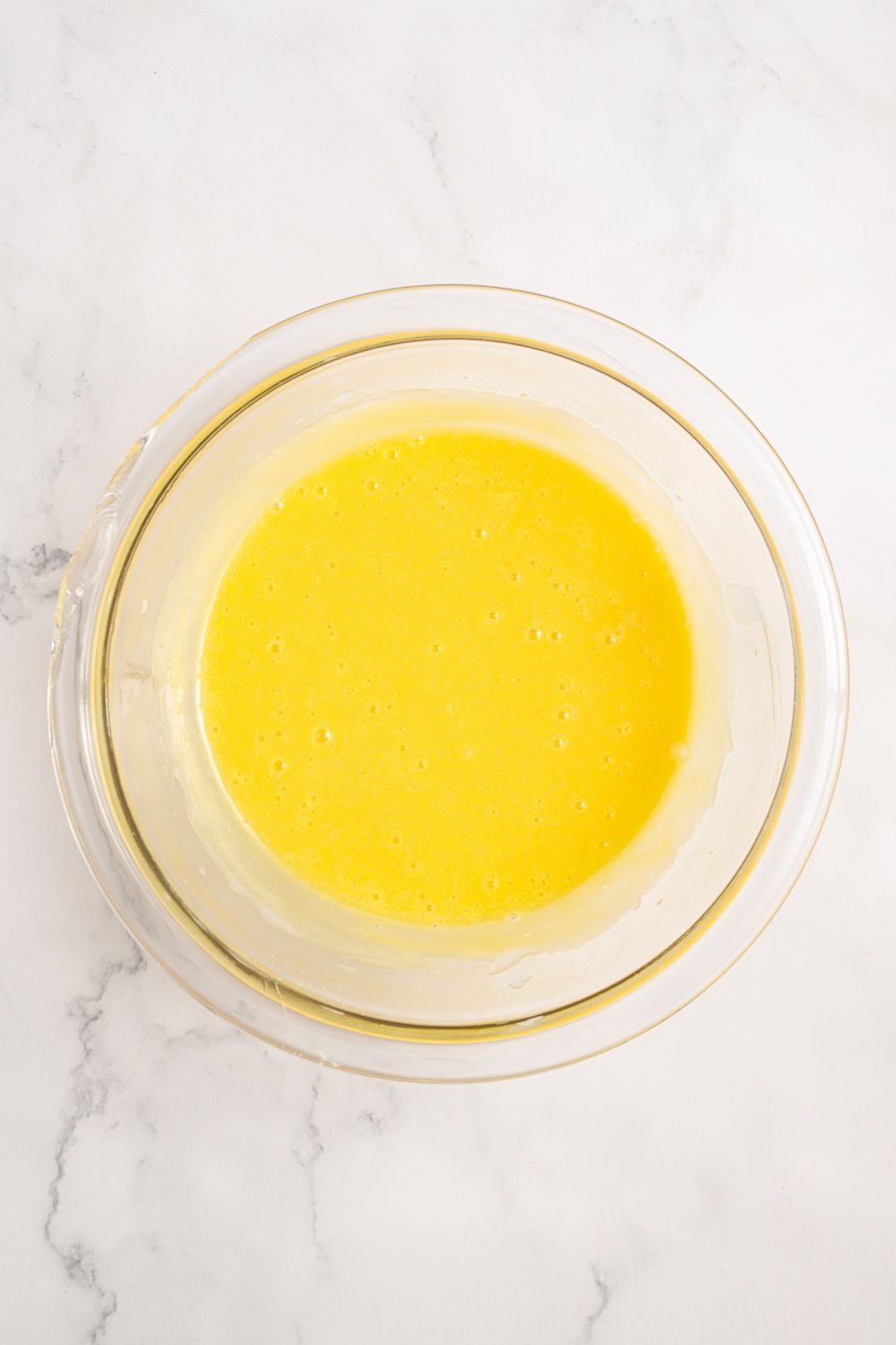 egg mixture in a glass bowl for Coconut Meringue Pie