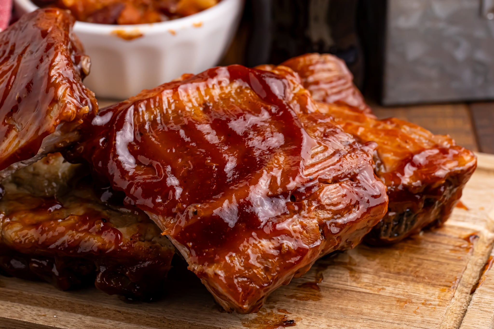 Slow Cooker Coca Cola Ribs cooked and placed on a cutting board on a table 