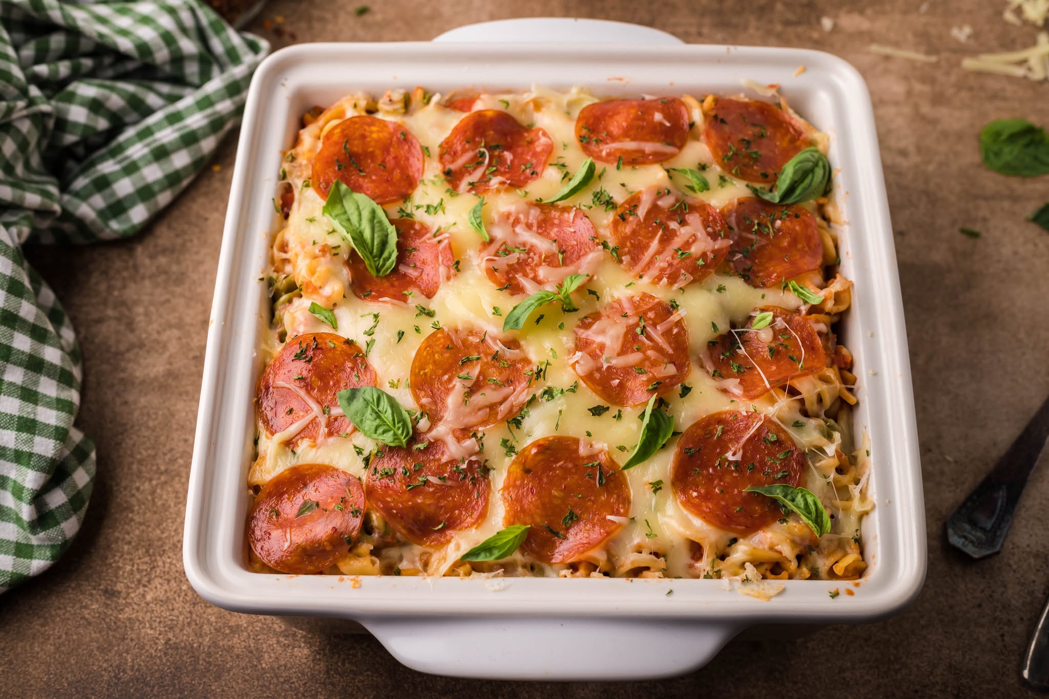 Tik Tok Pizza Pasta Casserole in a square white baking dish