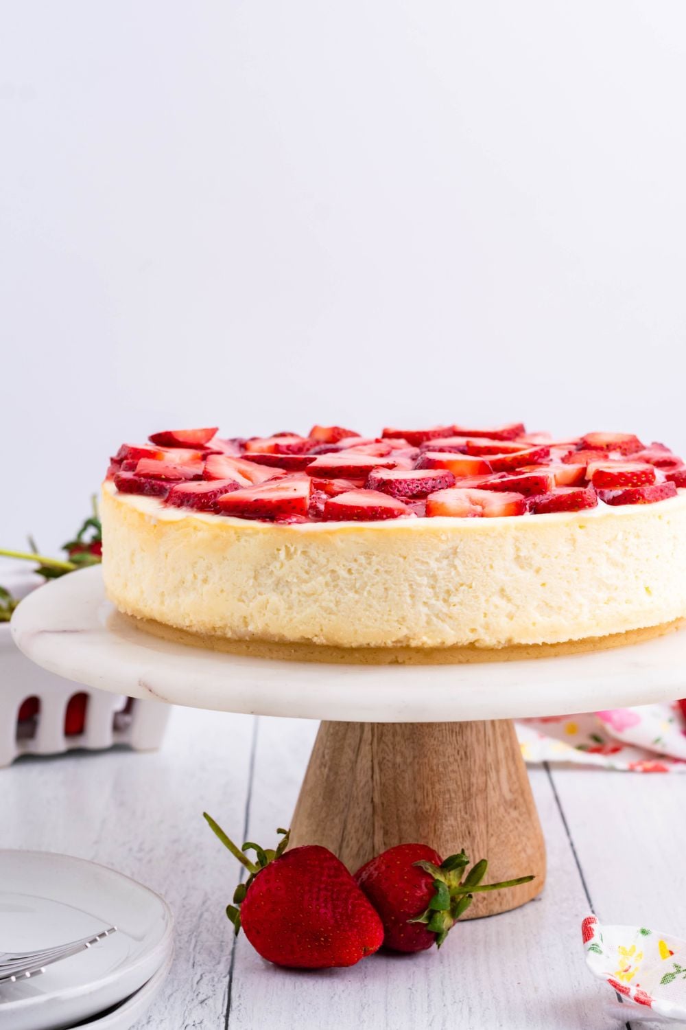 Keto Cheesecake on a cake platter on table 
