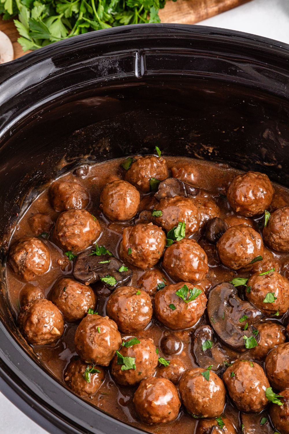 Crock Pot Salisbury Steak Meatballs in a slow cooker sitting on a table