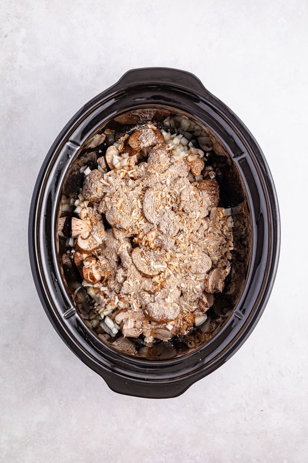 ingredients for this Crock Pot Salisbury Steak Meatballs recipe in a crockpot on table
