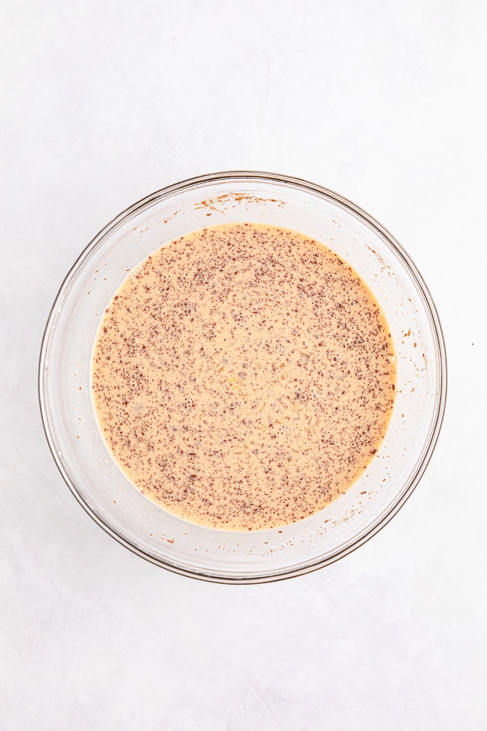 egg custard mixture in a glass bowl for French toast 