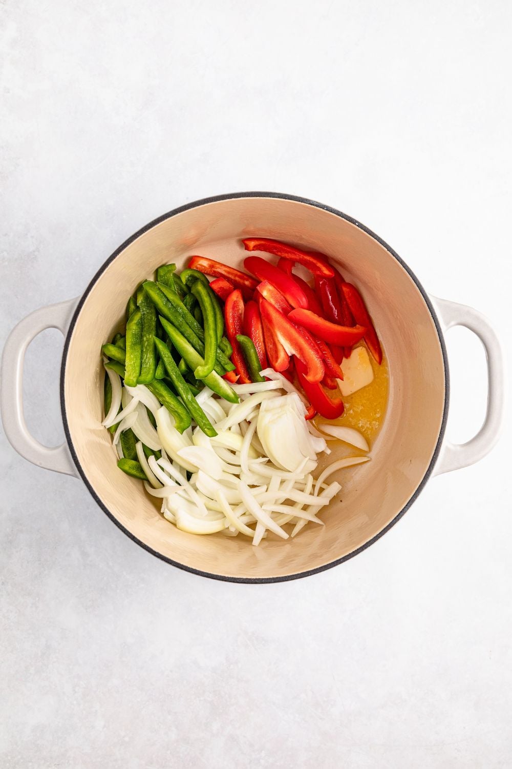 peppers and onions in a stock pot with some melted butter for rasta pasta