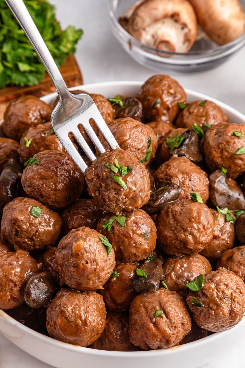 Salisbury Steak Meatballs in a bowl with a fork poking into one of them