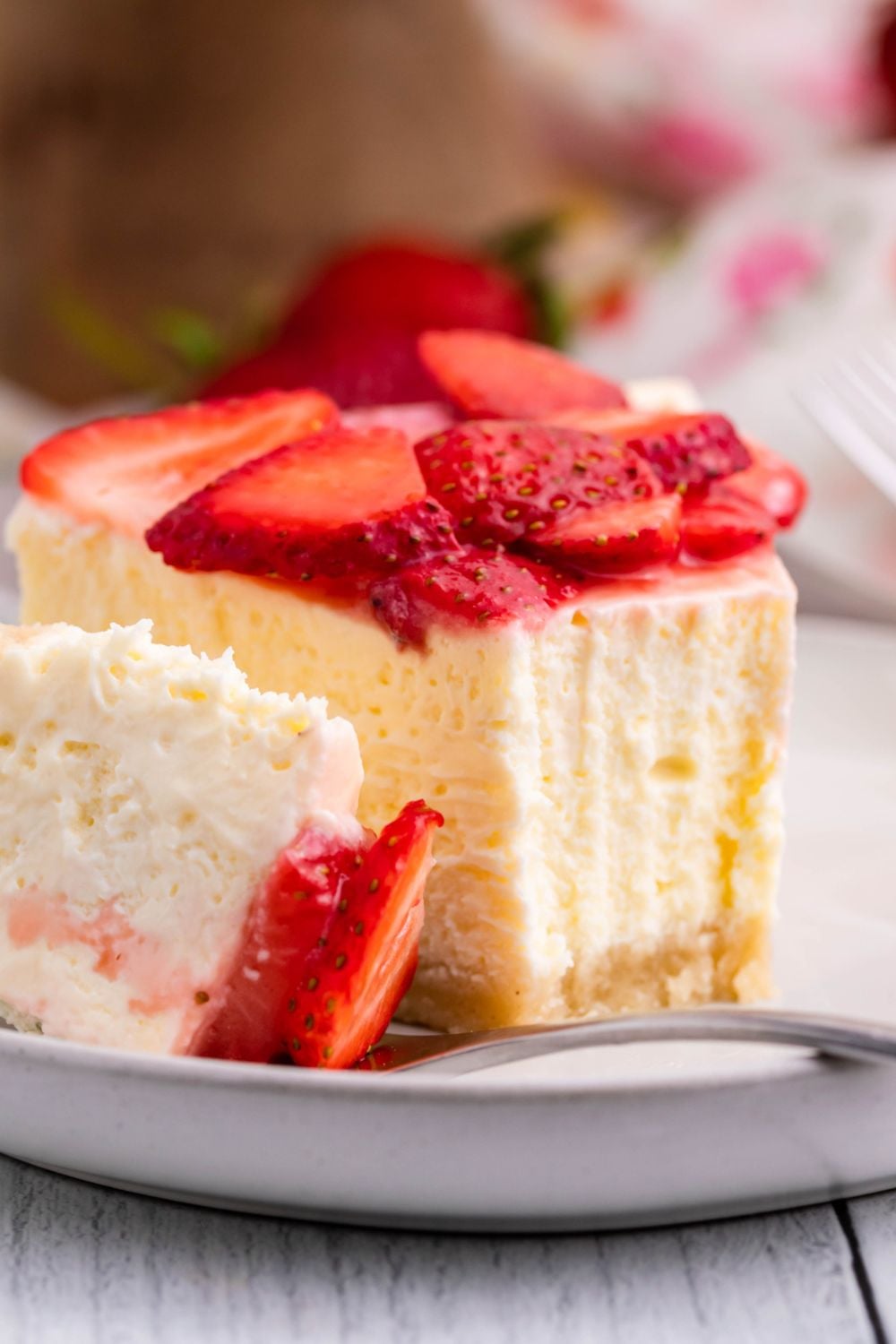 Keto Cheesecake on small plate with a bite taken out of the cheesecake slice 
