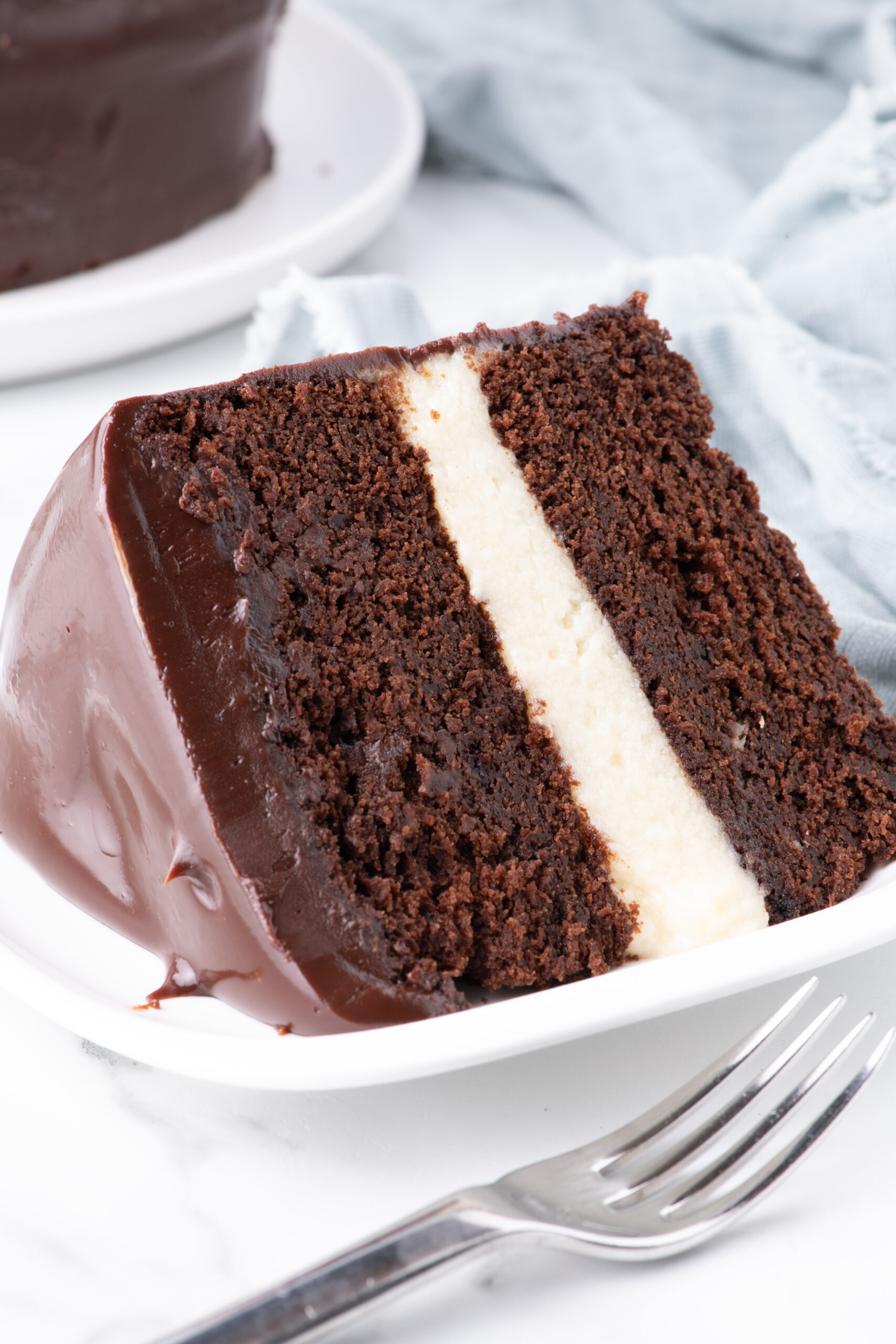 up close shot of Slice of Ding Dong Cake on a white plate showing the center