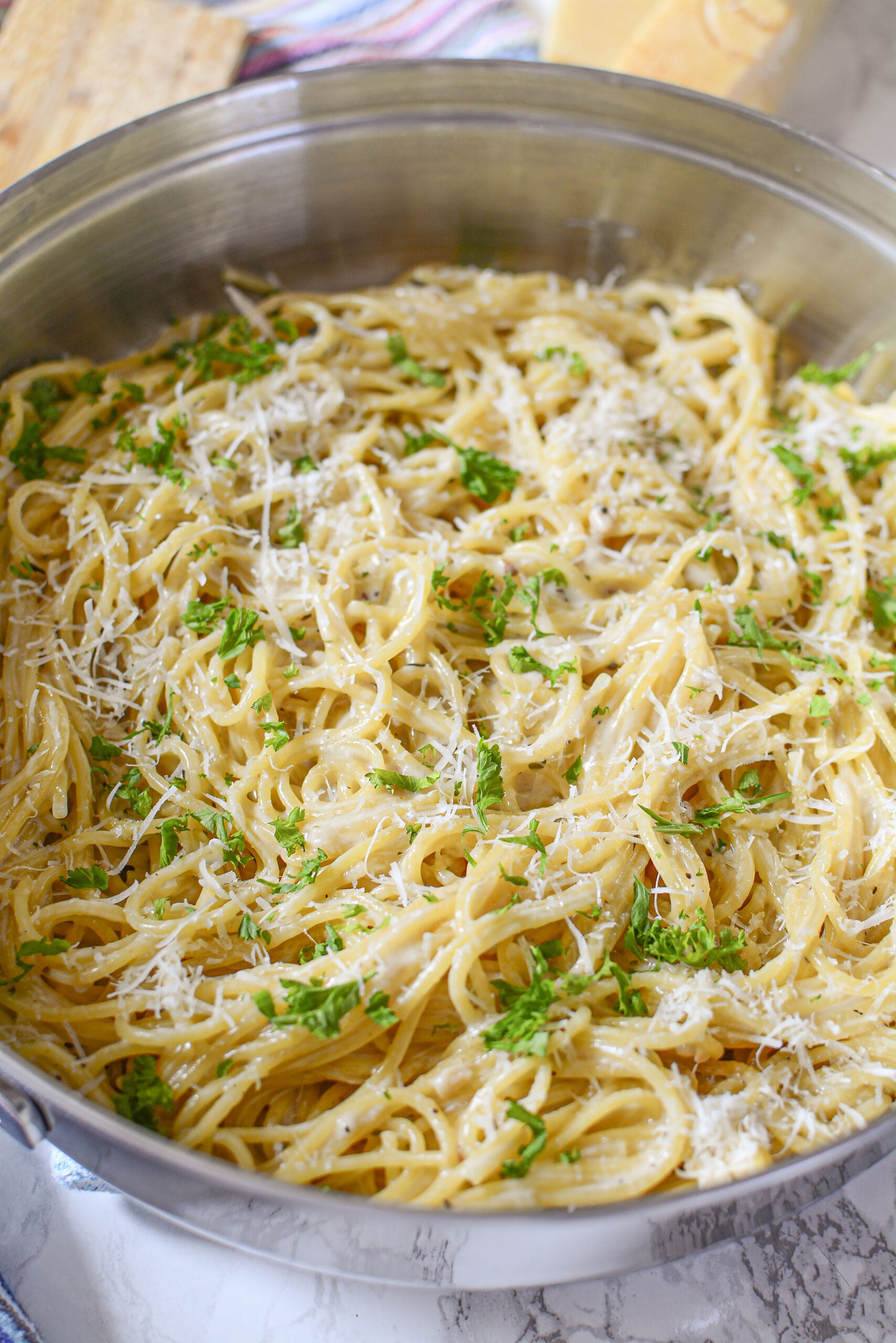 up close shot of the Garlic Parmesan Pasta in a skillet on a marble table