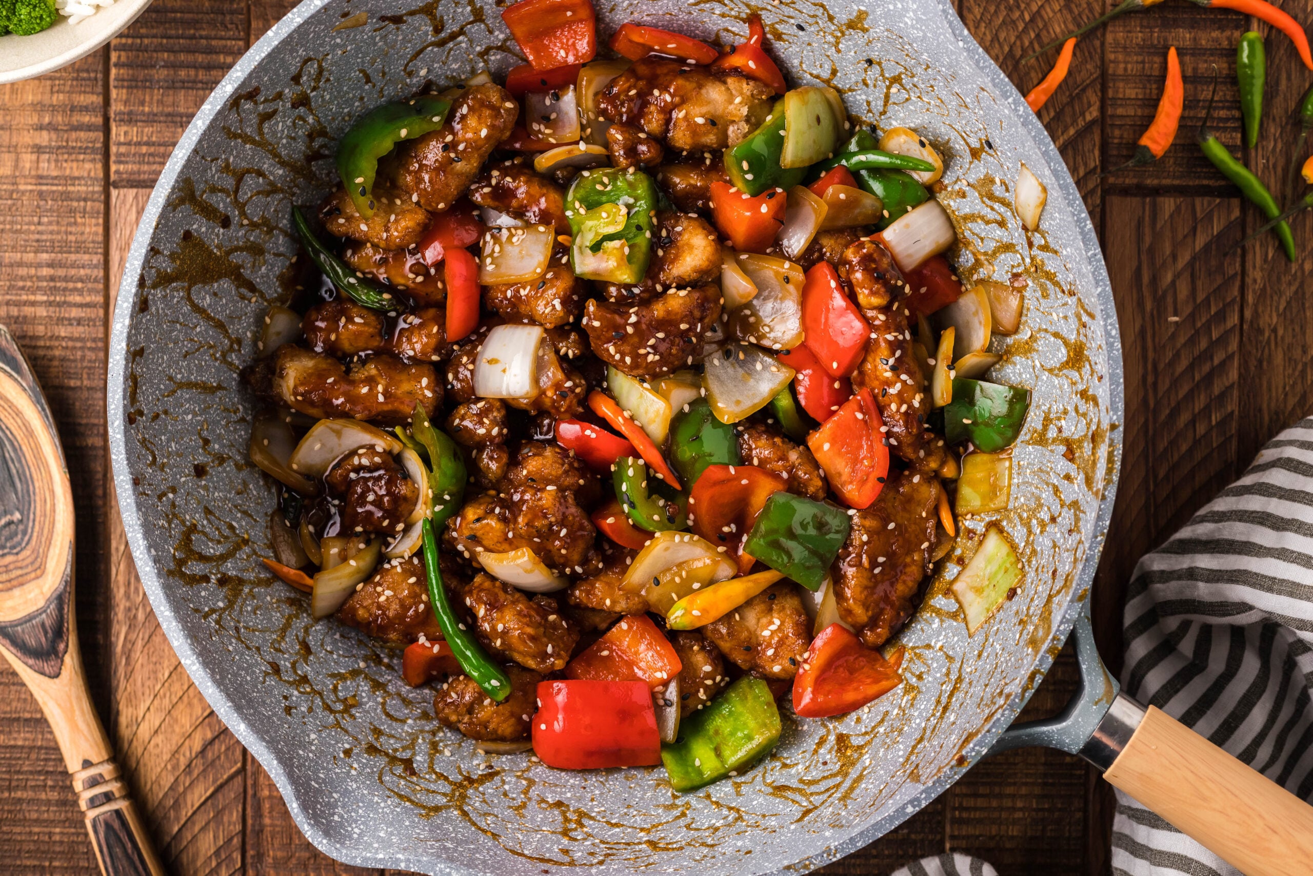 overhead shot of the General Tso Chicken on a dark wood table