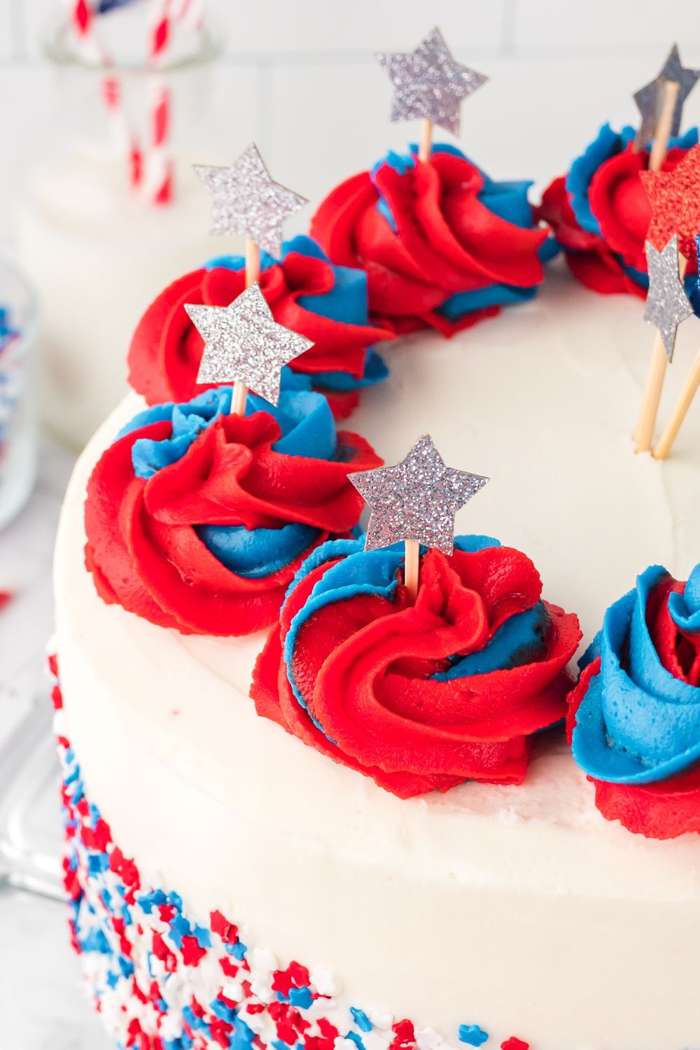 American Flag Cake on table with close up to see stars poked into cake with toothpicks 