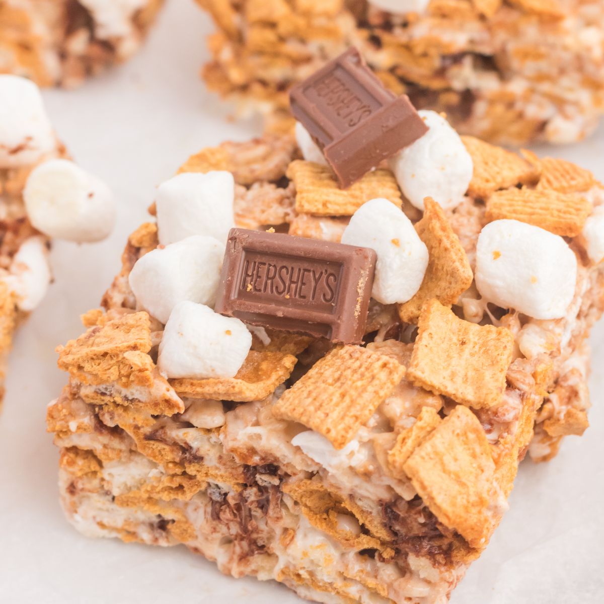 S’mores Rice Krispy Treats cut into squares and placed on table 