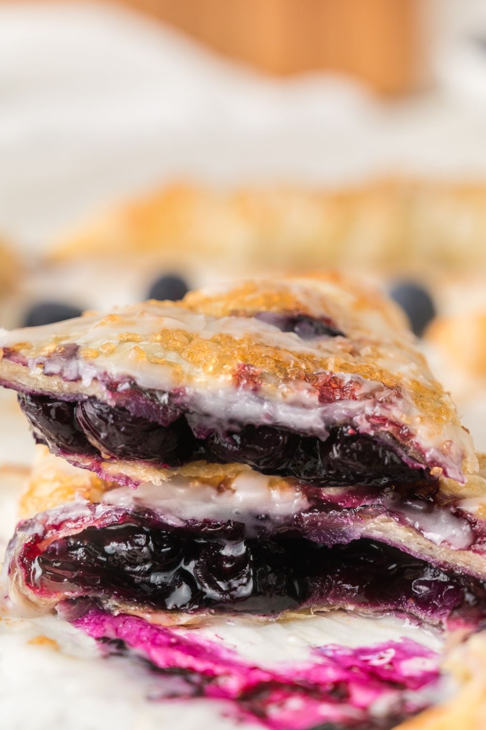 Blueberry Turnovers sliced and stacked on top of one another