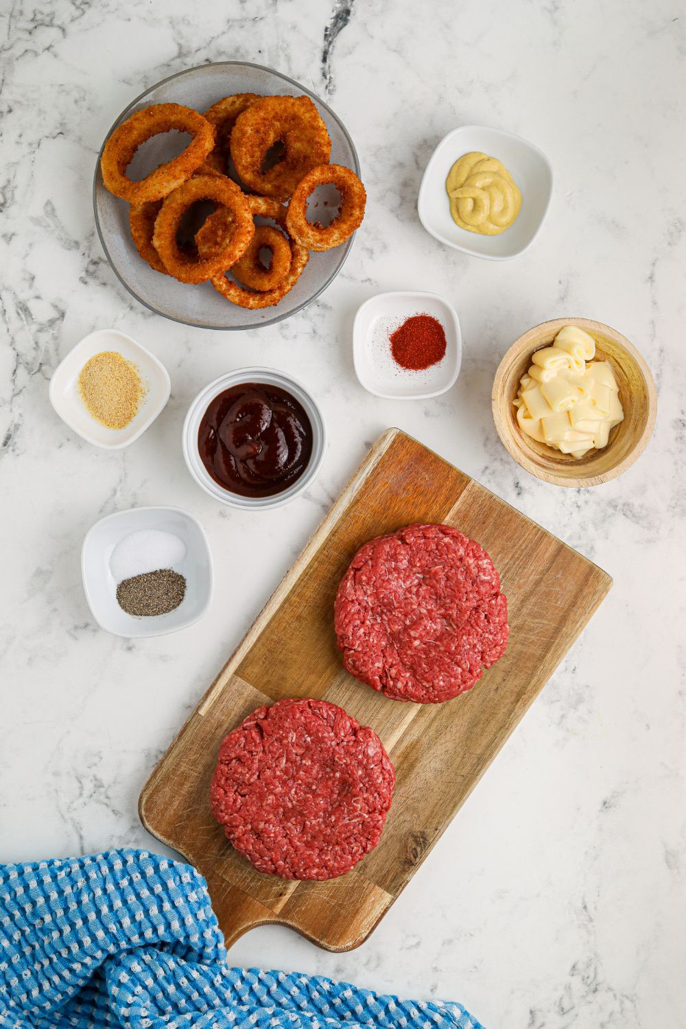 ingredients for Cowboy Burgers on table in single serve containers