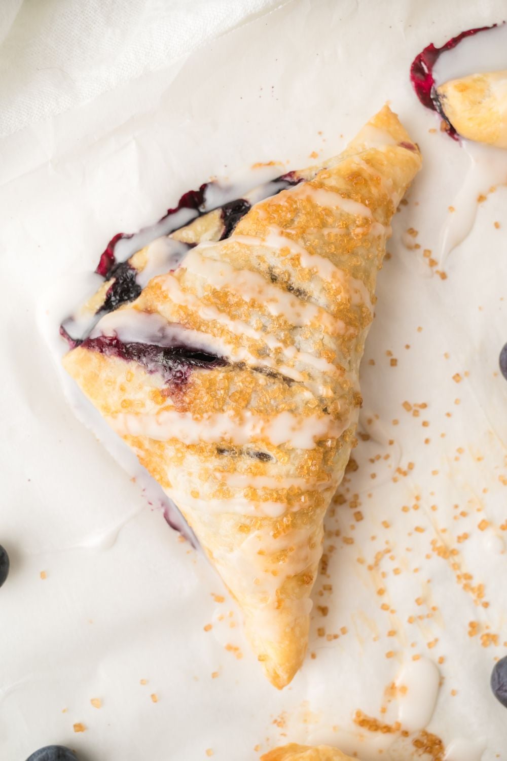 overhead of Blueberry Turnover on parchment paper