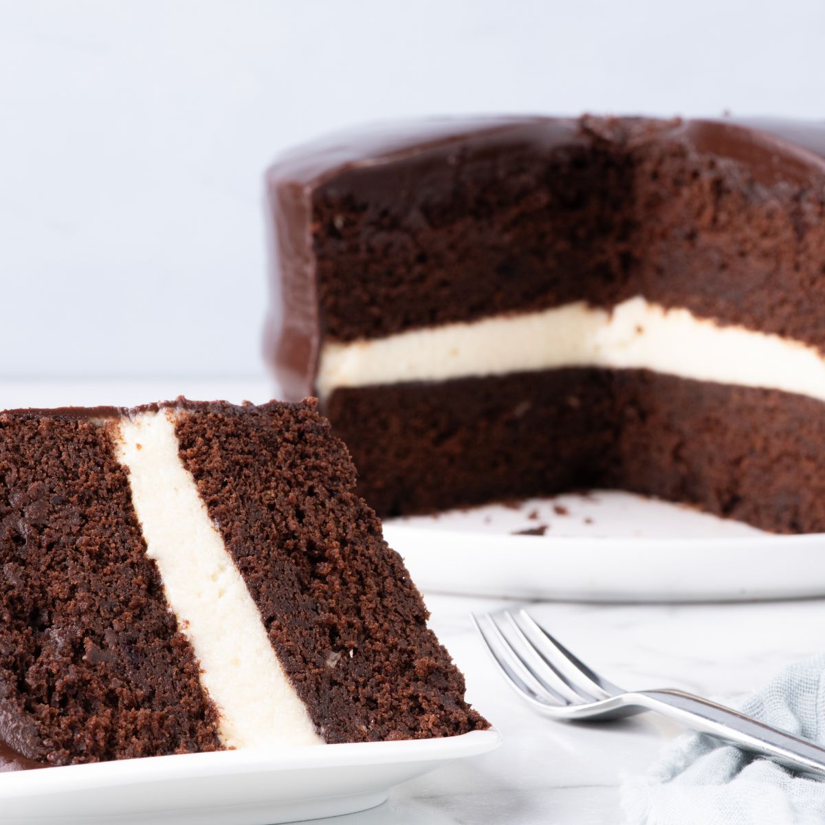 Ding Dong Cake on table with a slice of cake on plate