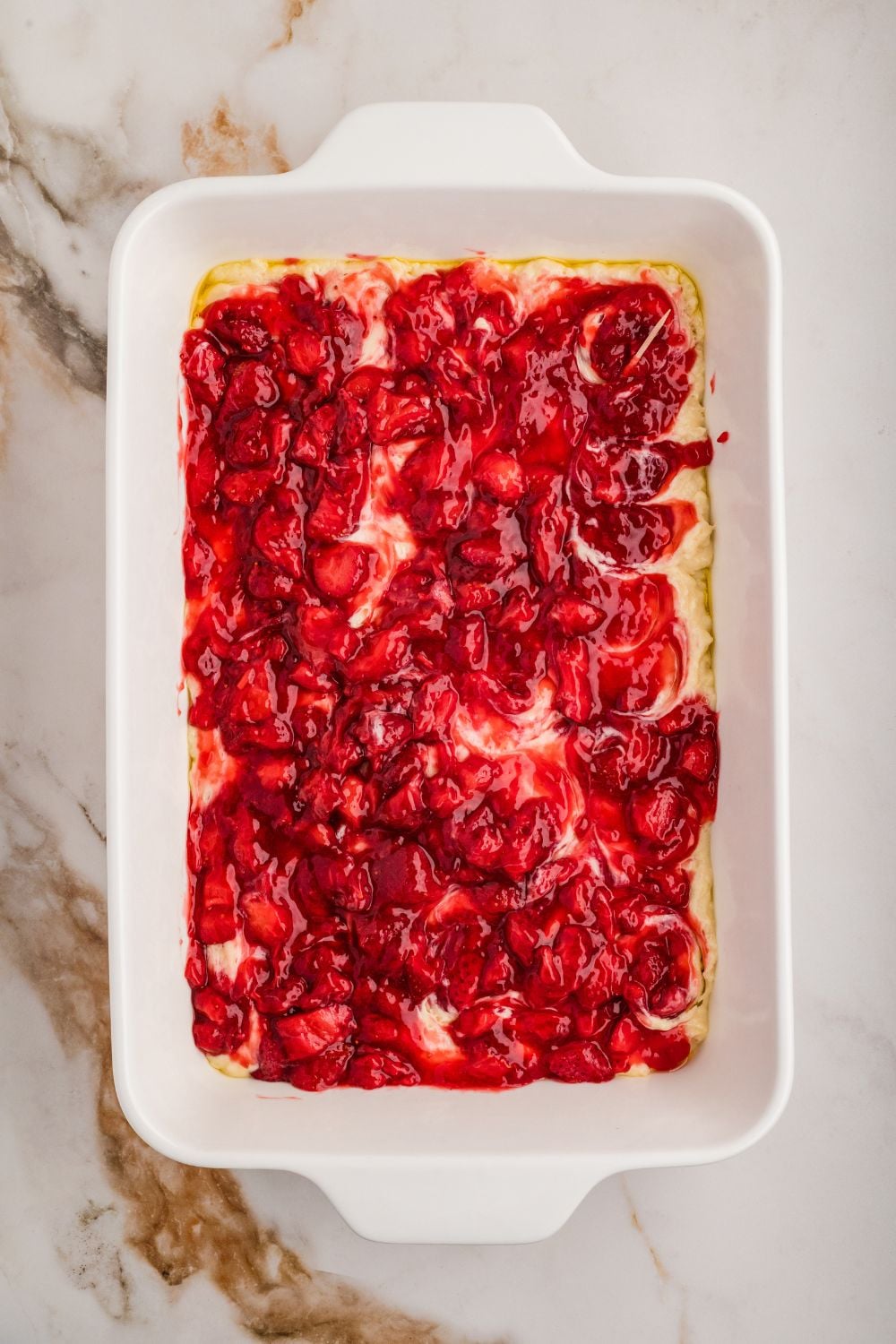 fruit topping on top of raw cake for Strawberry Coffee Cake