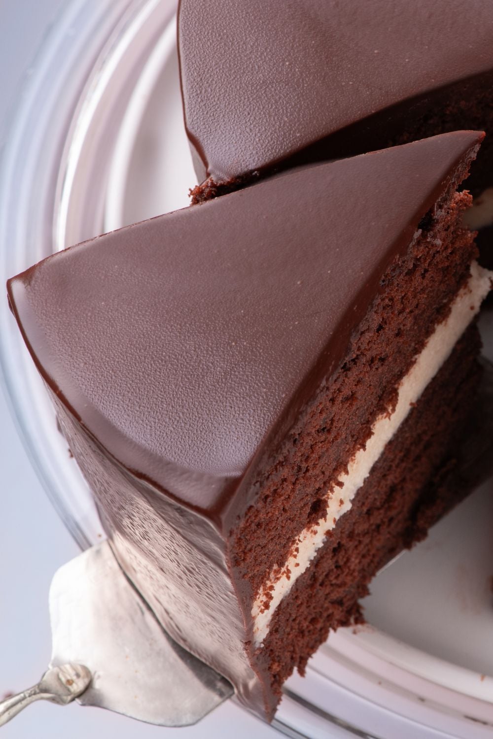 Hostess Ding Dong Cake on plate with a slice of cake being lifted out with a spatula