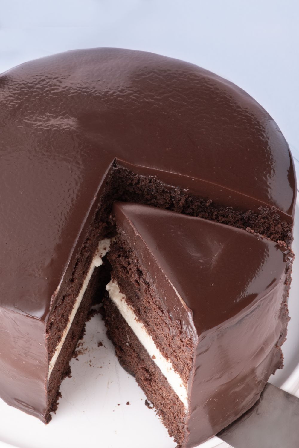 Ding Dong Cake with a slice being lifted up with a cake spatula