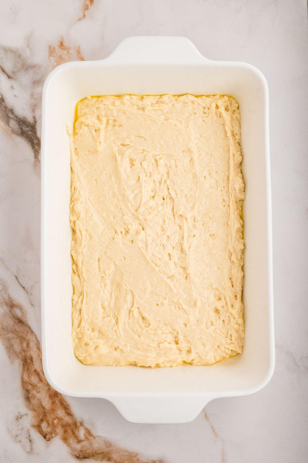 cake batter in a casserole dish