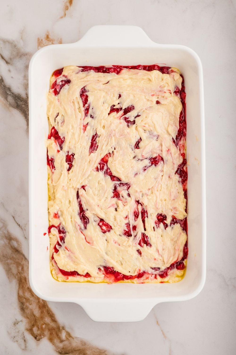 Strawberry Coffee Cake raw batter in a casserole dish