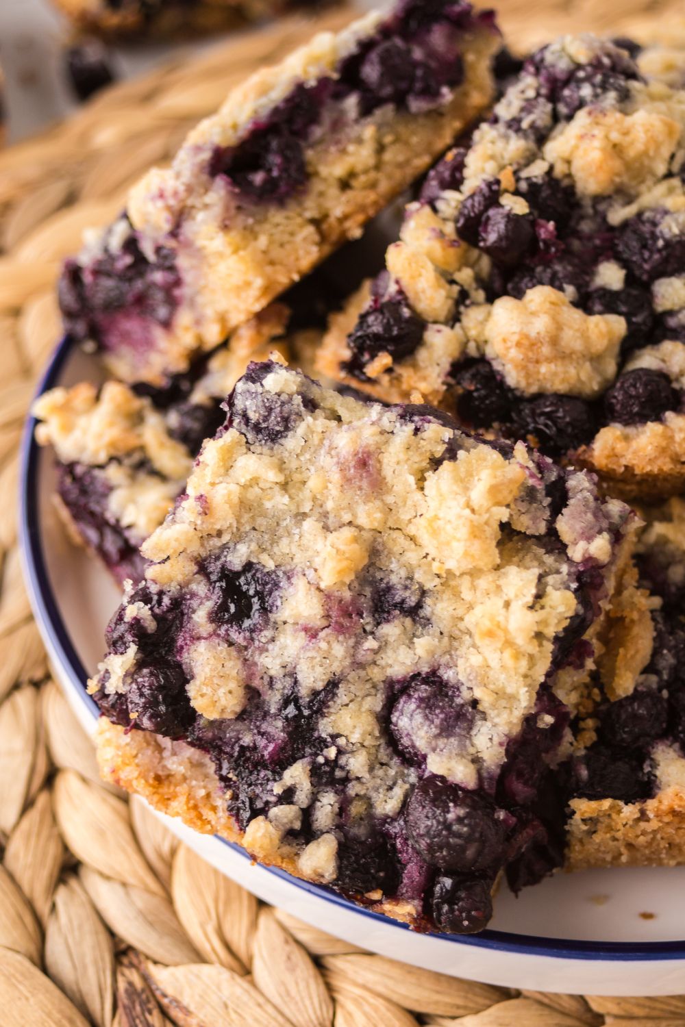 Blueberry Crumb Bars in a bowl that are sliced in squares