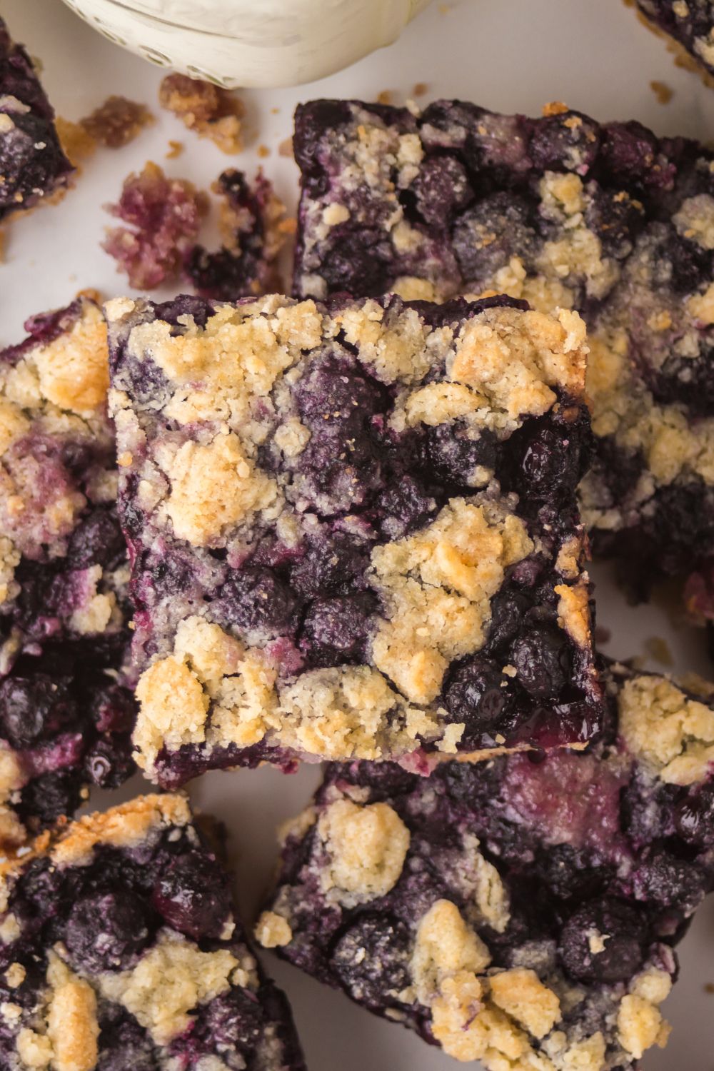 Blueberry Crumb Bars stacked on top of one another