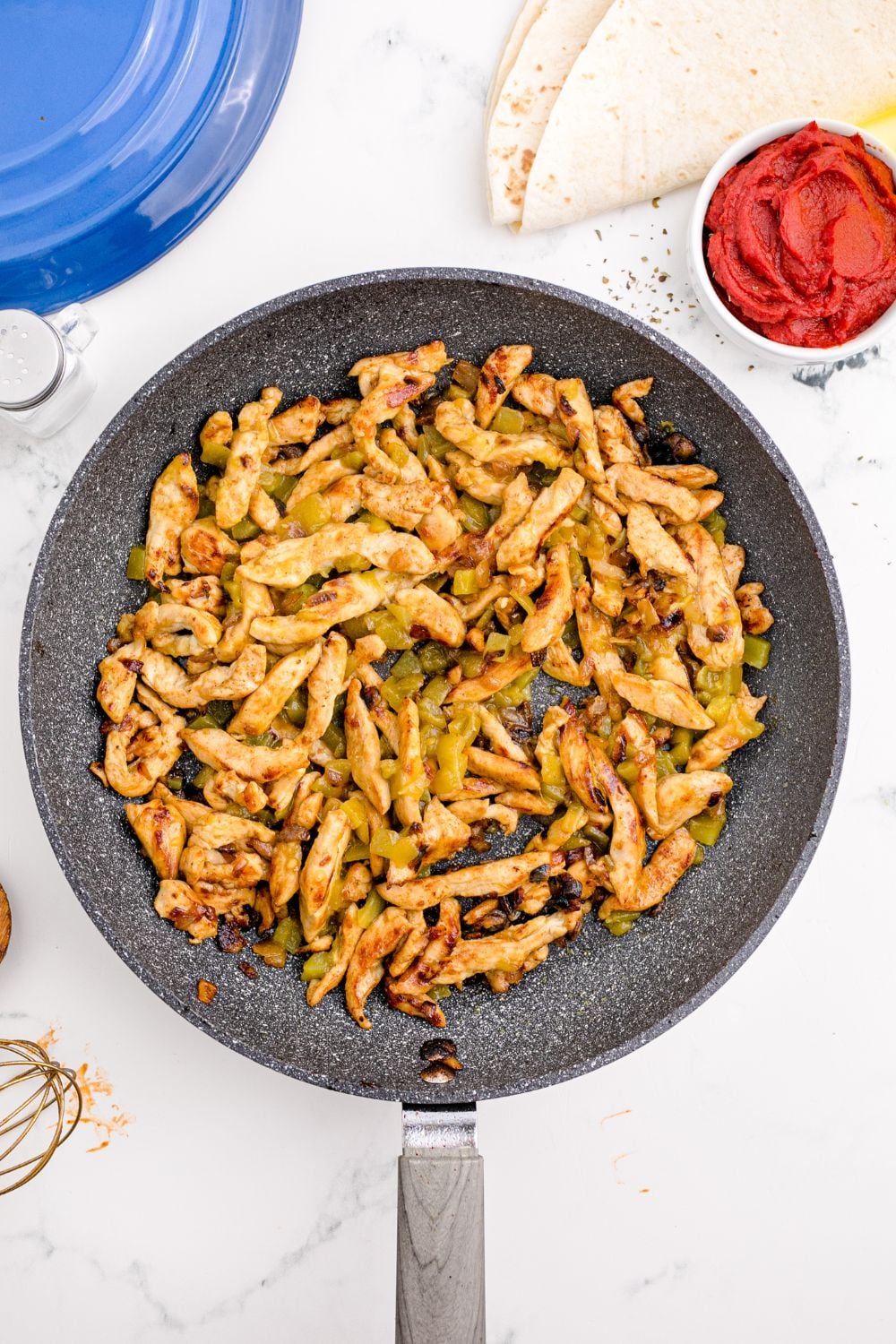 skillet seared chicken in a pan sitting on table