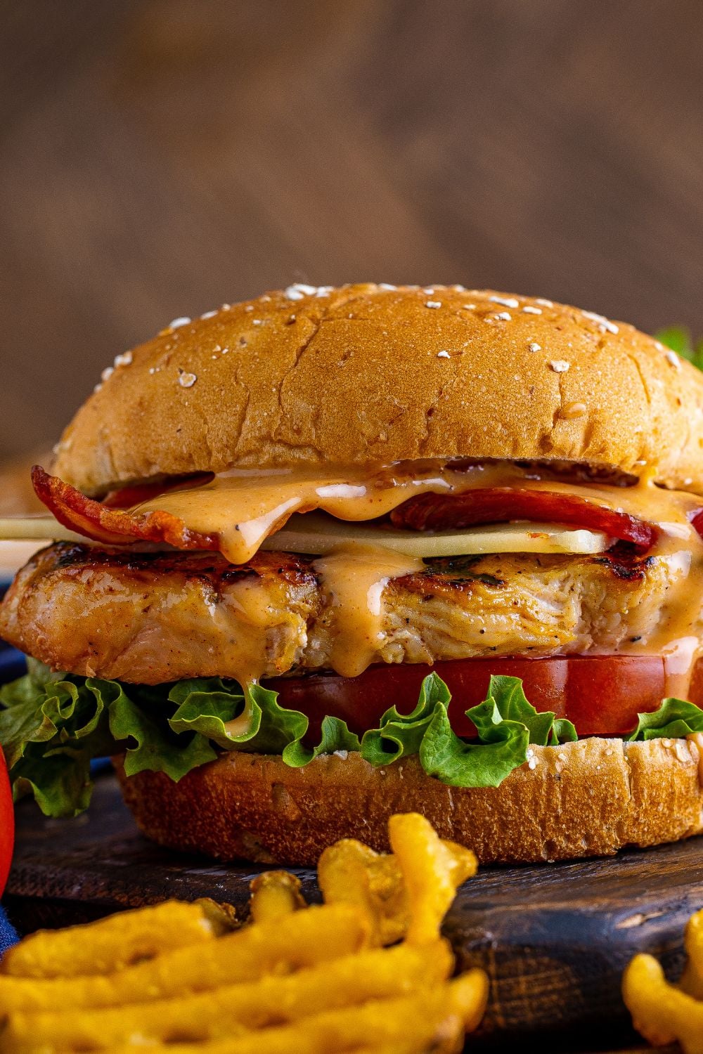 Chick Fil A Grilled Chicken Sandwich on table, with a side view of it 