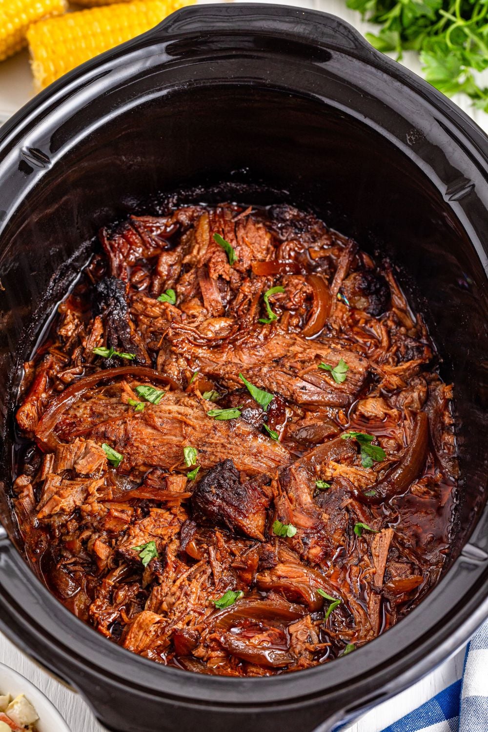 Slow Cooker BBQ Brisket in a slow cooker on table 