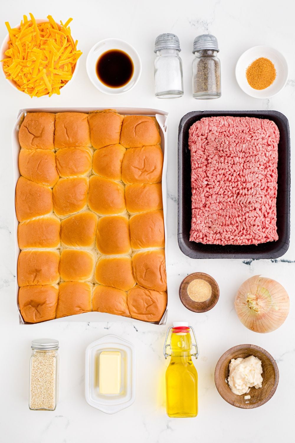 all the ingredients for Classic Cheeseburger Sliders spread out on table