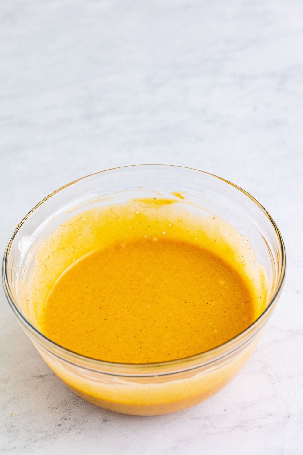 honey roasted bbq sauce mixed up in a glass bowl on table 