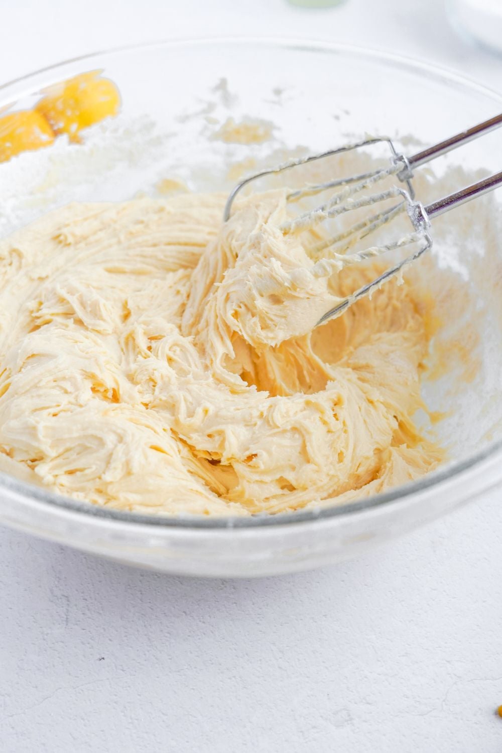 whipped batter for Lemon Sugar Cookie Bars in a glass bowl
