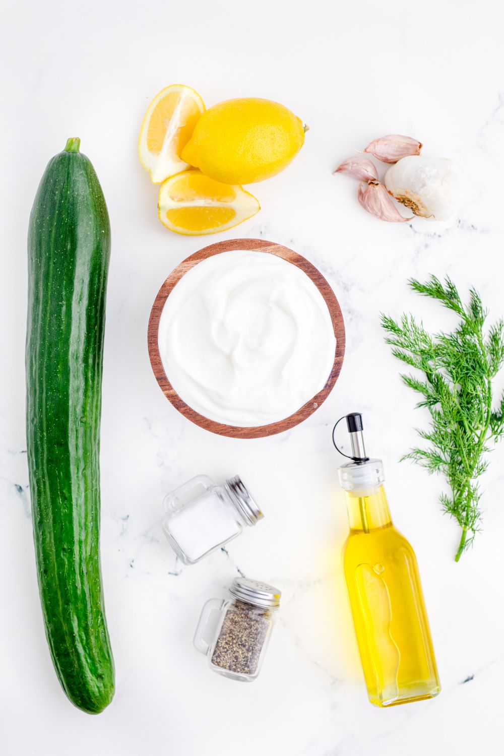ingredients for Tzatziki Sauce on table in single serve containers