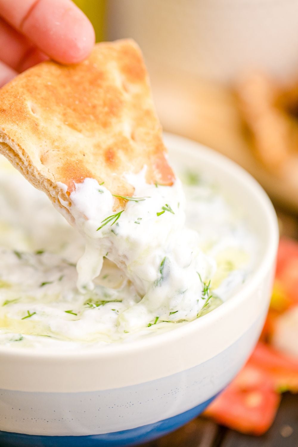 pita bread dipped in Tzatziki Sauce