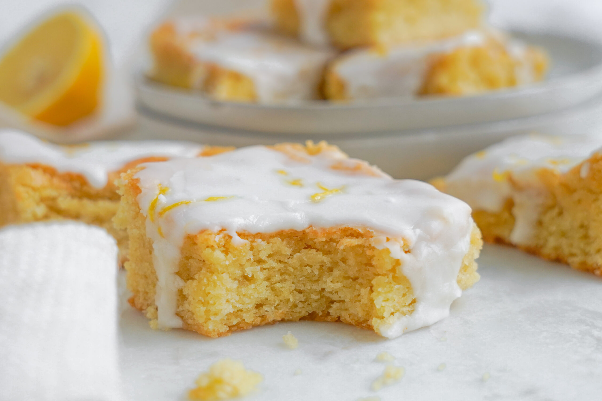 lemon bar up close with a bite missing