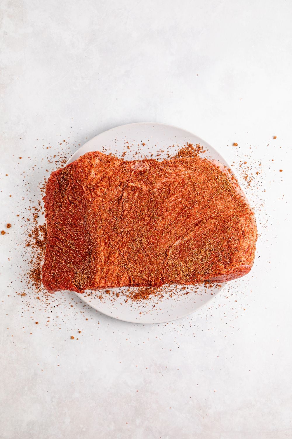 dry rub coated brisket on a plate on table